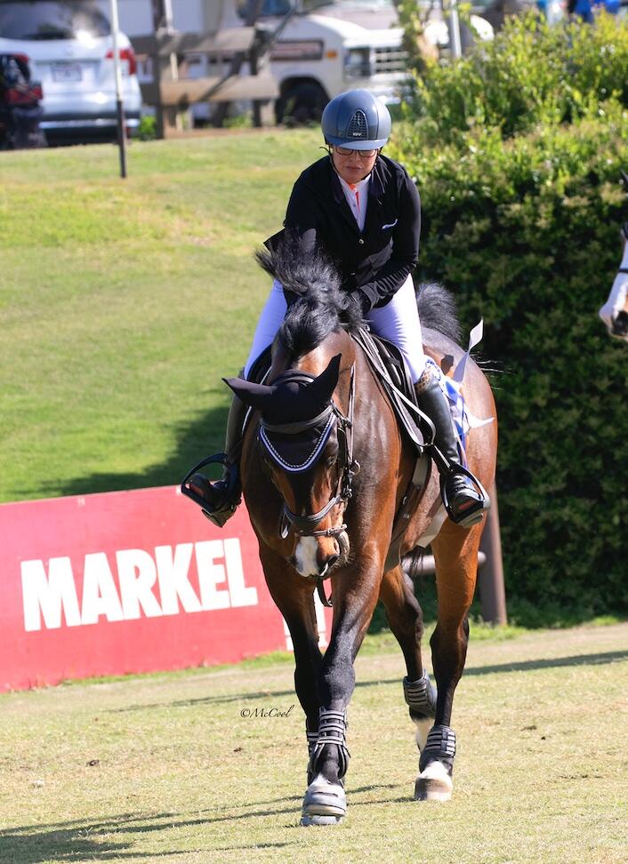 Nicole Haunert leads the victory gallop aboard Concolue