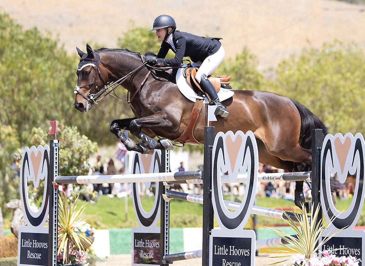 Nicole Haunert leads the victory gallop aboard Concolue