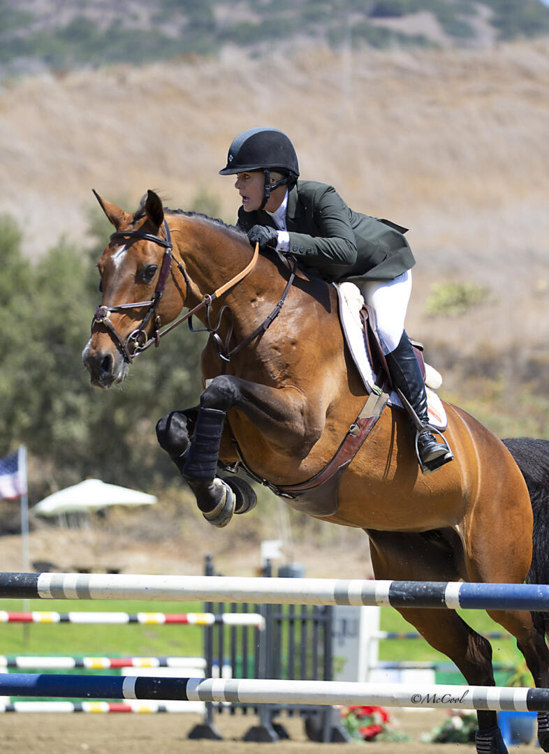 Nicole Haunert leads the victory gallop aboard Concolue