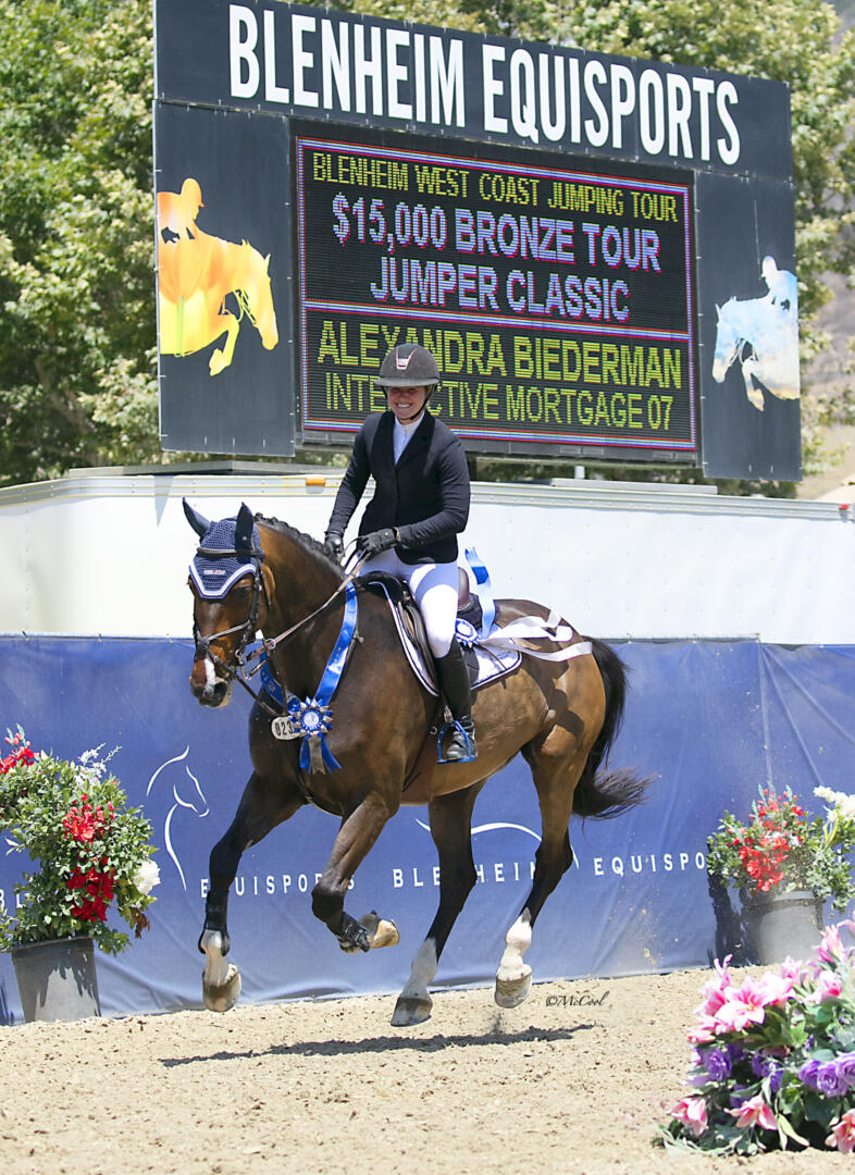 Nicole Haunert leads the victory gallop aboard Concolue