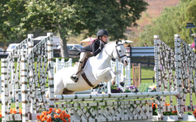 Kathryn Padilla and Heavenly Patch of Blue Reign in USHJA Pony Hunter Derby Championship – West